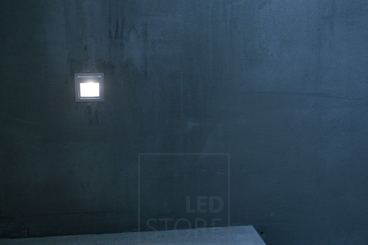 Atmospheric, soft light from a wall light above a staircase step